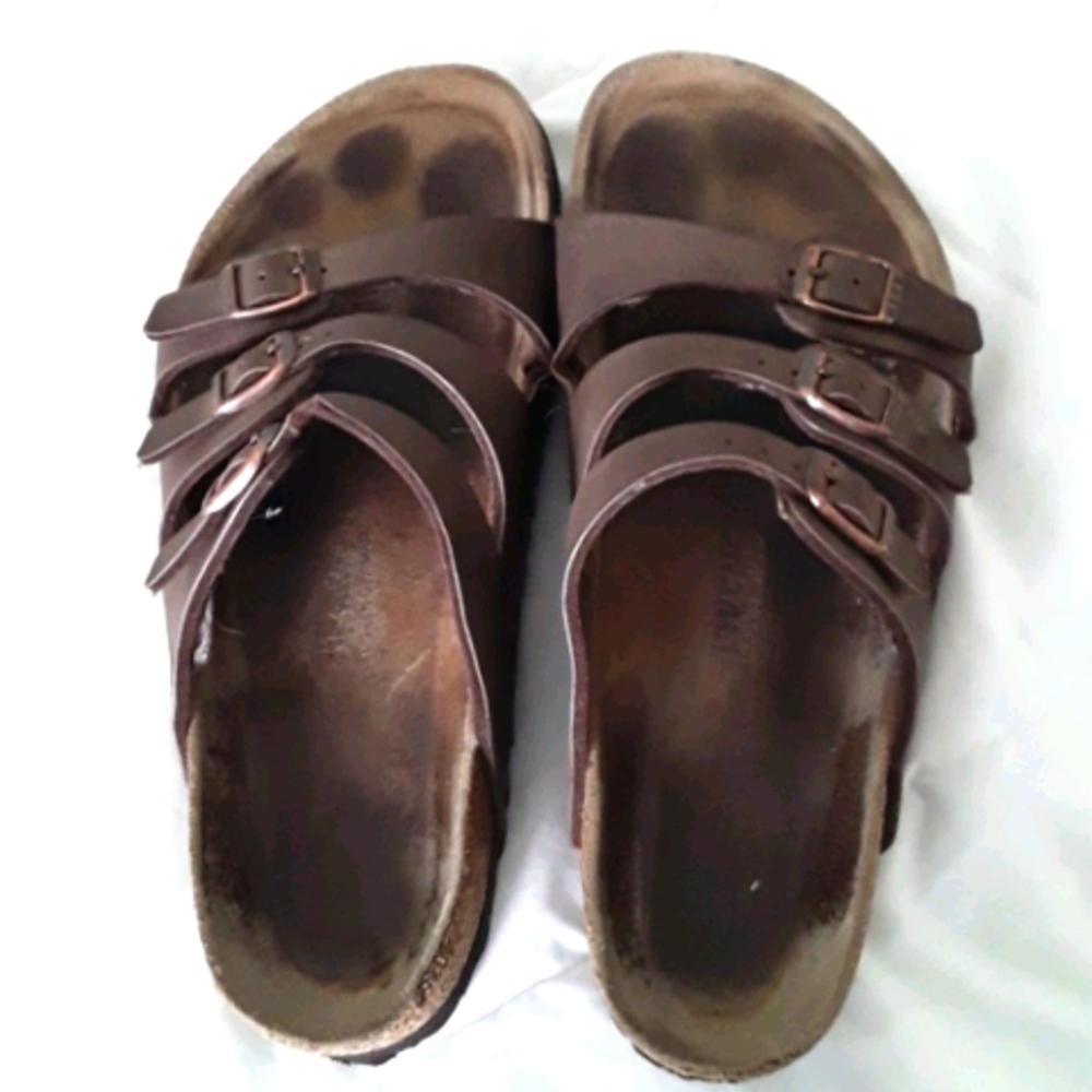 Brown leather Birkenstock sandals.